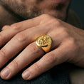 Load image into Gallery viewer, Gold plated Ganesha signet ring worn on finger, Hindu spiritual elephant deity ring with raised relief and bold signet style