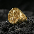Load image into Gallery viewer, Gold plated Holy Eucharist signet ring on dark volcanic rock, chalice and host relief with wheat and vine motif, cross on band