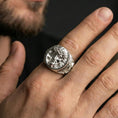 Load image into Gallery viewer, Polished silver Jesus Christ ring worn on finger, round portrait signet with clean reflective bezel and bold band