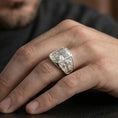Load image into Gallery viewer, Polished silver Jesus of Nazareth signet ring worn on finger, detailed Christ portrait and cross band