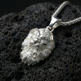 Load image into Gallery viewer, Polished silver Chinese guardian lion Fu Dog pendant displayed on volcanic stone background with sharp carved texture