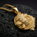 Load image into Gallery viewer, Gold plated Fenrir wolf pendant showcased on volcanic rock as a symbol of Viking strength and untamed power