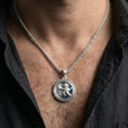 Load image into Gallery viewer, Polished silver mythical winged lion medallion worn on chest highlighting protection and strength symbolism