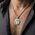 Load image into Gallery viewer, Polished silver Yggdrasil amulet worn on chest highlighting Viking mythology and interconnected worlds