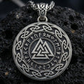Load image into Gallery viewer, Oxidized Valknut rune pendant necklace photographed on volcanic rock with engraved Norse runes and interlocked triangle symbol