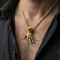 Load image into Gallery viewer, Gold plated Elden Ring inspired Hand of Maliketh pendant worn by man as bold statement jewelry for gamers