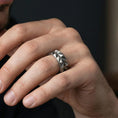 Load image into Gallery viewer, Polished silver angular wedding band worn on hand emphasizing sharp geometry and architectural design language