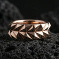 Load image into Gallery viewer, Rose gold plated faceted minimalist ring presented on volcanic rock surface with sculptural architecture and premium contemporary finish