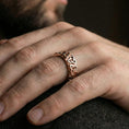 Load image into Gallery viewer, Rose gold Celtic knot band ring worn on finger as spiritual and symbolic jewelry