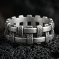Load image into Gallery viewer, Oxidized wicker cross weave band ring photographed on volcanic rock with rustic basket pattern and artisan texture
