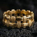 Load image into Gallery viewer, Gold plated basket weave band showcased on volcanic rock with premium rustic luxury aesthetic and textured craftsmanship