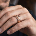 Load image into Gallery viewer, Rose gold plated lotus floral band ring worn on model with soft romantic look, symbolic rebirth meaning, and elevated gift-ready style