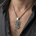 Load image into Gallery viewer, Oxidized 925 sterling silver foo dog pendant worn on neck, Chinese guardian lion dog tag necklace on braided chain