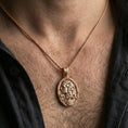 Load image into Gallery viewer, Rose gold plated Persephone pendant worn on neck, Greek goddess mythology oval medallion necklace with pomegranate motif