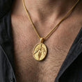 Load image into Gallery viewer, Gold plated phoenix pendant worn on neck, firebird medallion necklace with myth-inspired statement style