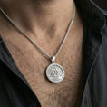 Load image into Gallery viewer, Polished silver valknut necklace worn on neck, geometric Norse knot pendant with clean shine and crisp relief