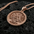 Load image into Gallery viewer, Rose gold plated valknut necklace on dark volcanic stone, Norse valknut medallion pendant with bold geometric lines