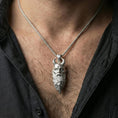Load image into Gallery viewer, Polished silver Mimir head necklace worn on neck, masculine Norse mythology pendant with realistic facial sculpture