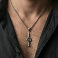 Load image into Gallery viewer, Oxidized ankh spear pendant necklace worn on neck, lifestyle close-up, pendant centered with braided chain