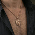 Load image into Gallery viewer, Rose gold plated Medusa medallion necklace worn on neck, lifestyle wear shot, warm plating tone and sculpted depth