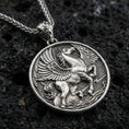 Load image into Gallery viewer, Oxidized sterling silver winged Pegasus medallion pendant on volcanic rock, high-relief flying horse design, macro shot