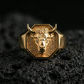 Load image into Gallery viewer, Gold plated bull head signet ring on volcanic rock, premium studio scene, powerful animal motif with sharp relief detail