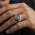 Load image into Gallery viewer, Oxidized Asian tiger signet ring worn on finger, lifestyle close-up, oval face centered with rugged masculine styling