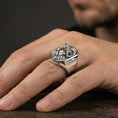 Load image into Gallery viewer, Polished silver ram head signet ring worn on finger, lifestyle hand shot, crisp sculpted ram face and horn texture