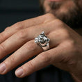 Load image into Gallery viewer, Polished silver puma head ring worn on finger, lifestyle hand shot, smooth feline head design with sculpted features