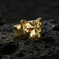 Load image into Gallery viewer, Gold plated puma head ring on volcanic rock, sleek wild cat head design with defined whisker dots, premium macro lighting