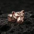 Load image into Gallery viewer, Rose gold plated puma head ring on volcanic rock, refined feline head ring with sharp eye detailing, luxury close-up