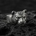 Load image into Gallery viewer, Oxidized sterling silver puma head ring on volcanic rock, smooth wild cat face with detailed eyes, macro product shot