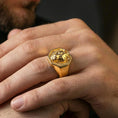 Load image into Gallery viewer, Gold plated lioness signet ring worn on finger, premium lifestyle photo, statement lioness emblem ring with octagonal face