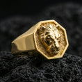 Load image into Gallery viewer, Gold plated lioness signet ring on volcanic rock, bold octagon signet with lioness head emblem and textured recessed field, premium studio lighting
