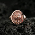 Load image into Gallery viewer, Rose gold plated tiger signet ring on volcanic rock, oval tiger crest ring with high-relief fangs and defined mane texture, luxury macro