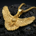 Load image into Gallery viewer, Gold plated owl pendant displayed on porous volcanic rock surface, close-up studio composition, sharp wing texture