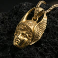 Load image into Gallery viewer, Gold plated Hermes pendant displayed on porous volcanic rock surface, close-up studio composition, detailed winged helmet and bail