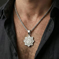 Load image into Gallery viewer, Polished silver Vishuddha pendant on chain worn on neck, natural lifestyle framing, geometric chakra motif clearly visible