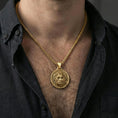 Load image into Gallery viewer, Gold plated Zeus necklace pendant worn on neck, close-up lifestyle shot, luxury lighting with refined metallic highlights