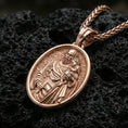 Load image into Gallery viewer, Rose gold plated Saint Joseph Christian pendant on volcanic rock, premium macro product photo, sharp relief and smooth oval frame