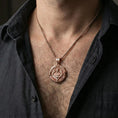 Load image into Gallery viewer, Rose gold plated Saint Uriel pendant necklace worn on neck, lifestyle composition with dark clothing, crisp medallion silhouette