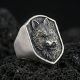 Load image into Gallery viewer, Oxidized sterling silver matte wolf head signet ring on volcanic rock, macro studio closeup