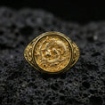 Load image into Gallery viewer, Gold plated koi fish signet ring on porous volcanic stone, premium dark background emphasizing the sculpted fish scales and ornate circular top