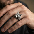 Load image into Gallery viewer, Oxidized lynx ring worn on finger, lifestyle close-up focusing on the realistic feline profile and engraved fur texture