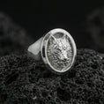 Load image into Gallery viewer, Polished silver wolf head ring on volcanic stone, crisp fur detailing and oval bezel profile