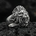 Load image into Gallery viewer, Oxidized sterling silver roaring lion ring on volcanic rock, macro closeup with deep contrast details