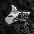 Load image into Gallery viewer, Polished silver shark ring on textured volcanic stone with macro focus on the jawline and teeth detailing