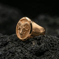 Load image into Gallery viewer, Rose gold plated ram head ring on porous volcanic rock with studio highlights and sharp relief definition