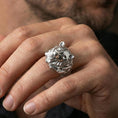 Load image into Gallery viewer, Polished silver bear head ring on a hand, close-up highlighting the fur carving and bold masculine silhouette