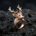 Load image into Gallery viewer, Rose gold plated deer antler ring on porous volcanic rock with controlled highlights and deep contrast